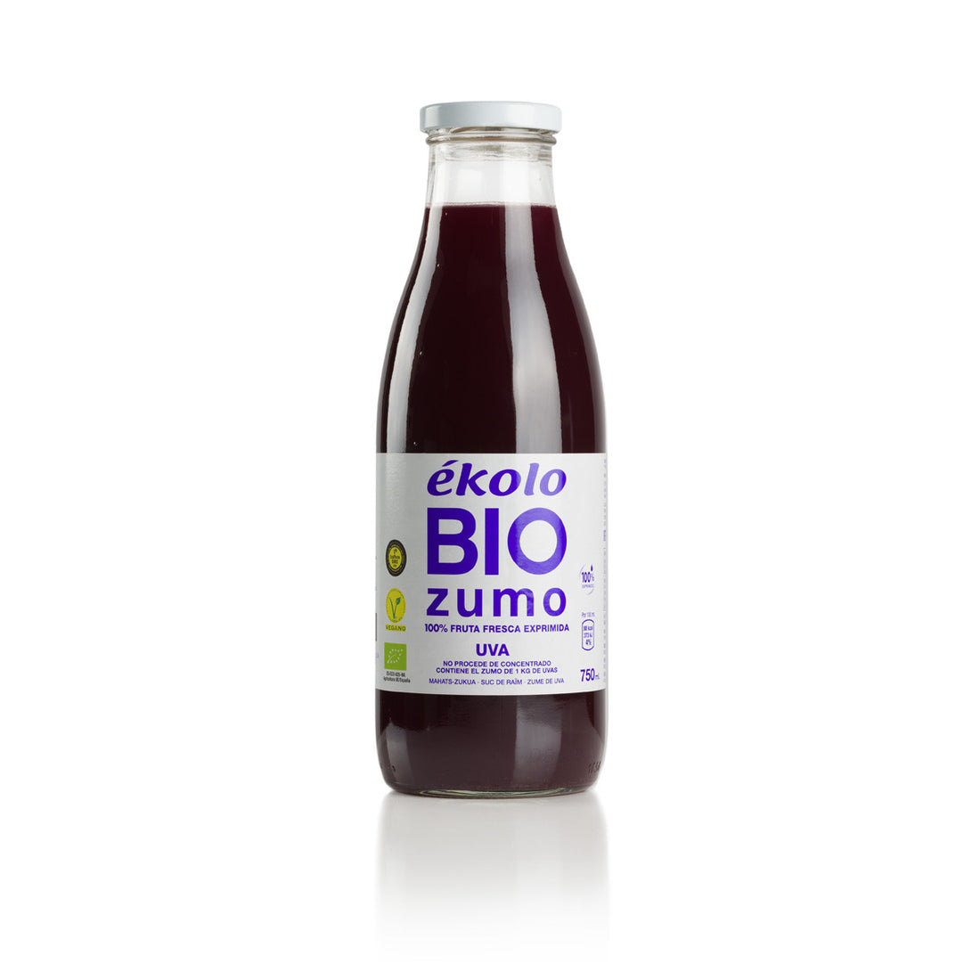 Deep purple grape juice in a glass bottle